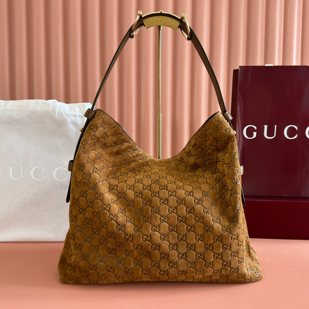 Gucci GG Embossed Leather Hobo Bag - Gold