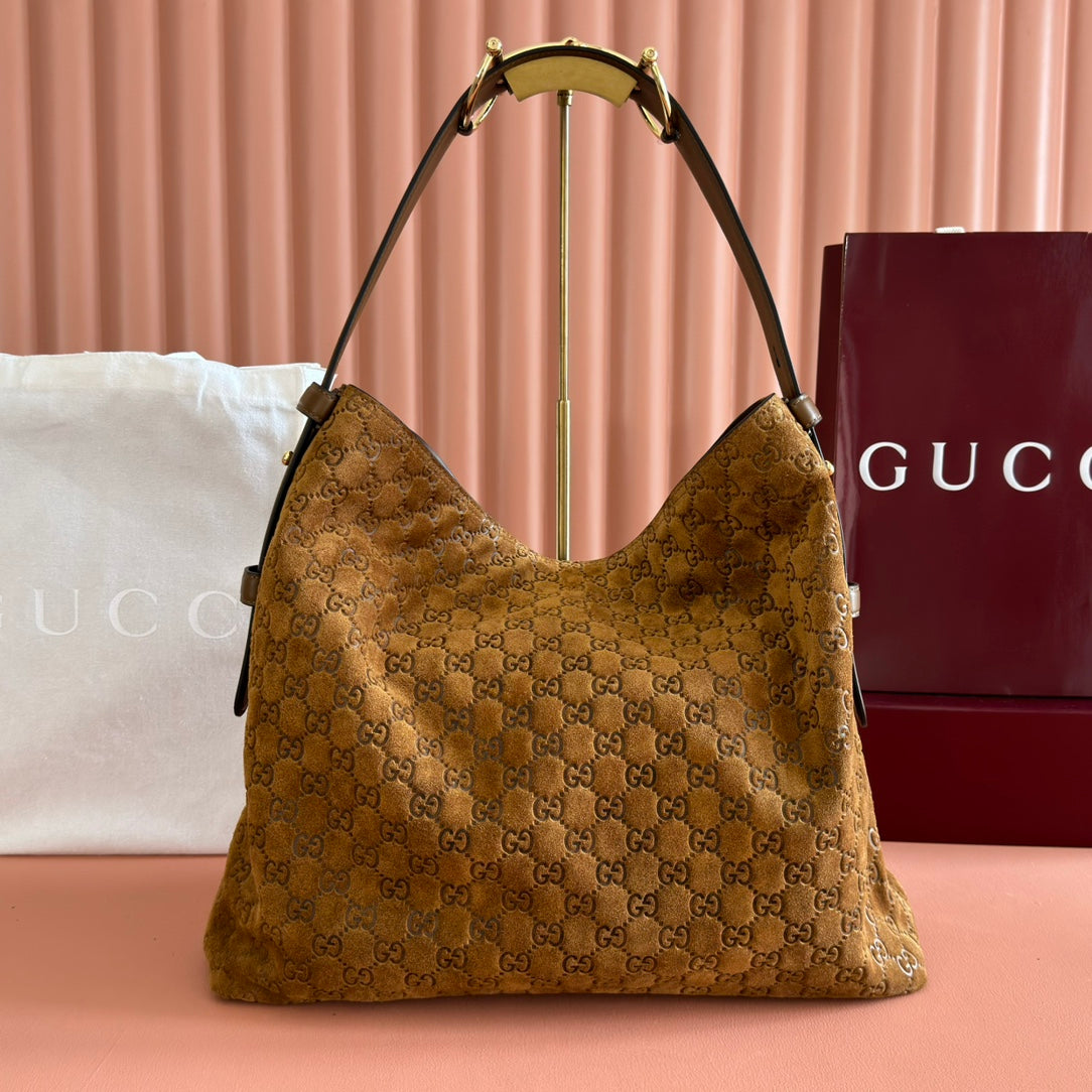 Gucci GG Embossed Leather Hobo Bag - Gold