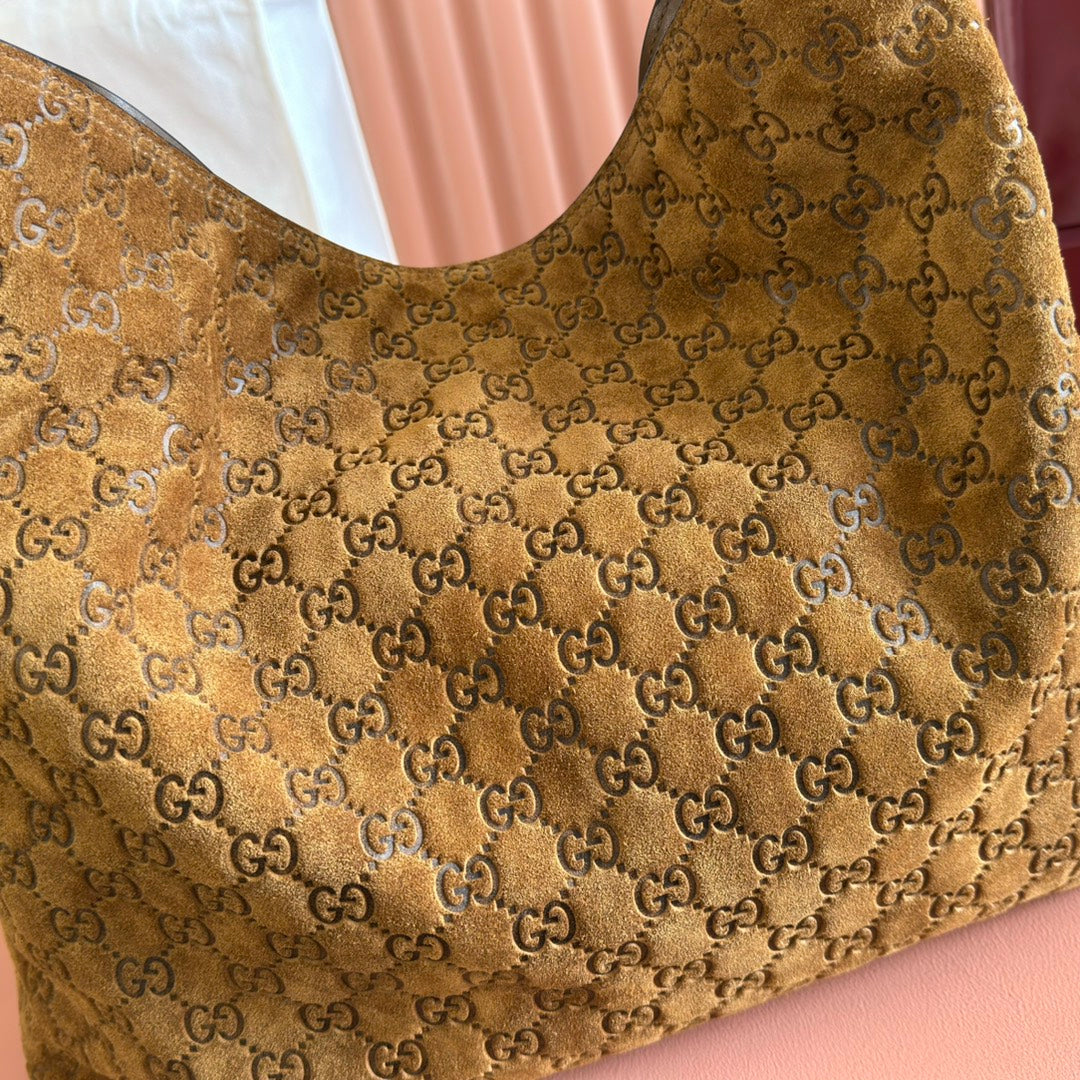 Gucci GG Embossed Leather Hobo Bag - Gold